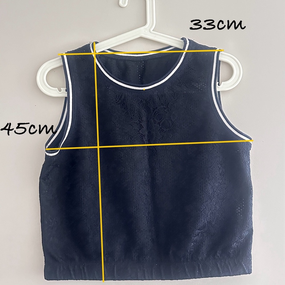 Black Sleeveless Top with White Trim